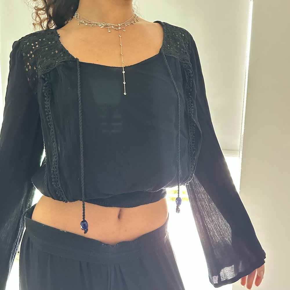 Patrons of Peace black bell sleeves embellished crop top with evil eye tassels